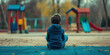 Lonely Child: Boy Sitting Alone on School Playground, Looking Distressed and Isolated.