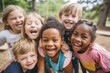© Adriana - Group of diverse cheerful fun happy multiethnic children outdoors at the schoolyard