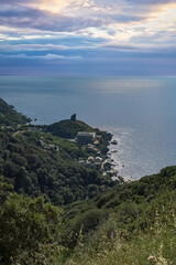 Wall Mural - Corsica, a traditional village in the mountain, ancient fortress, with the sea in background
