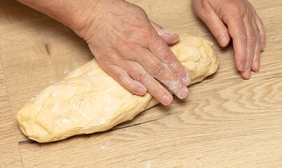 Sticker - A woman kneads dough with her hands