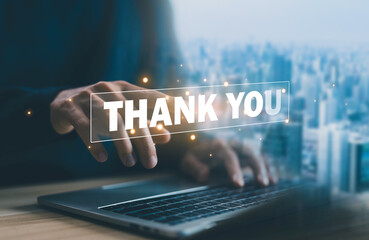 presentation from technology digital, a businessman using a laptop and showing the message thank you on a display screen. concept of congratulations, thank you in business, appreciation, and gratitude