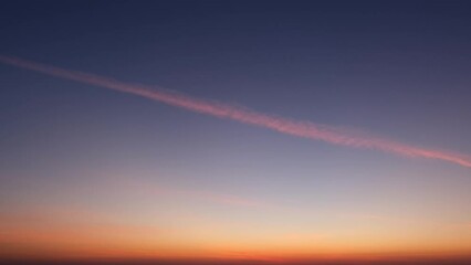 Wall Mural - 4K : Sunrise sky time lapse - The timelapse video captures the beauty of the sunrise sky adorned with layers of fluffy white clouds, painting a palette of vivid hues.
