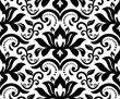 Floral vector ornament. Seamless abstract classic black white background with flowers. Pattern with repeating floral elements. Ornament for wallpaper and packaging