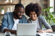 © Straxer - African American Couple Working on Laptop stock photo