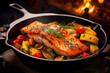 Close-up of cooked salmon fillet served with roasted vegetables, set on a cast-iron pan.