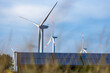 © Westend61 - Solar panels and wind farm turbines