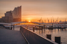 Germany, Hamburg, St. Pauli Pier At Moody Sunrise With Elbphilharmonie In Background
