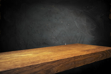 Wall Mural - Wooden table with dark blurred background. High quality photo