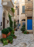 Fototapeta Uliczki - Polignano a Mare, Italy - one of the most beautiful cities on the Adriatic Sea, Polignano a Mare is a main landmark in Apulia. Here in particular its narrow alleyways 