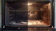 An image of a dirty oven filled with a variety of food. Perfect for illustrating the need for cleaning or the messiness of cooking.