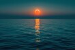 Solar eclipse over calm waters of the sea or ocean. Atmosphere of peace and tranquility