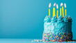Birthday cake with blue frosting and yellow candles ready for a party, blue background