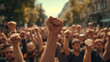 A group of people raised their fists up in the street, strike rally, asserting their rights