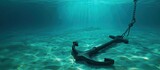 The rusty ship anchor is under the sea