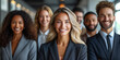 © aekkorn - Portrait of successful group of business people at modern office looking at camera. Portrait of happy businessmen and satisfied businesswomen standing as a team. Multiethnic group of people smiling.