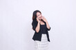 © Ajab - the charm of a beautiful Asian office woman in her 20s, laughing expression while making a phone call on a cell phone gadget while covering her mouth isolated on a white background