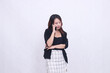 © Ajab - the charm of a beautiful Asian office woman in her 20s, expression chatting on a cellphone gadget with her arms crossed, isolated on a white background