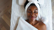 © Sawoon - Black African American woman in her 40s at Skin Clinic spa salon getting beauty skincare treatment, for self-love health and wellness anti ageing care for perimenopause and menopause