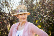 © Austockphoto - Portrait of a woman in a hat in the garden