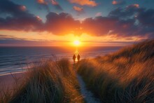 As The Morning Sunlight Reflects Off The Calm Ocean Waters, Two Figures Walk Along The Beach Path, Surrounded By The Peaceful Afterglow Of A Beautiful Sunset
