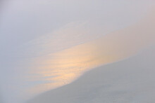 Minimalist Image Of A Subtle Sand Gradient With The Gentle Gleam Of A Sunset Reflected On The Shore