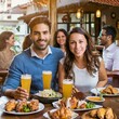 © Israel - Pessoas alegres no bar à noite com porções de frango na mesa