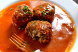 Fototapeta Sport - Le boulet  with tomato sauce with pieses of bunching onio non top