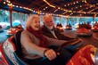 A smiling man and woman sit in a colorful bumper car, their faces illuminated by the indoor lights as they enjoy the thrill of the playful vehicle