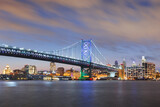 Fototapeta  - Philadelphia, Pennsylvania, USA skyline on the Delaware river with Ben Franklin Bridge