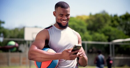 Wall Mural - Athlete, cellphone and basketball on court with happiness, technology and text message or social media . Black man, laughing and smartphone for streaming online and funny sport videos on mobile app