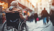 Woman in wheelchair in the street