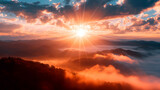 Fototapeta Na sufit - sunrise over the mountains with clouds, sunlight, mist