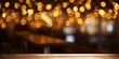 © Lasvu - Blurry dark background, cafe/restaurant/bar with empty light golden bokeh wooden table.