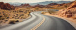 © Oleksandr - Winding empty road through arid desert landscape