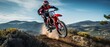 © Onchira - motorcycle stunt or car jump, A off road moto cross type motor bike in mid air during a jump with a dirt trail