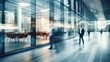 © FoxTok - Blurred business background. Walking businessmen in a modern glass office center, shopping mall, bank. Movement effect, stylish interior with green plants