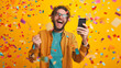 © Creator - Young man celebrating victory or lottery win, holding phone, shouting joyfully, surrounded by falling confetti.