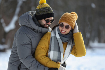 Wall Mural - Beautiful happy couple outdoors on winter day