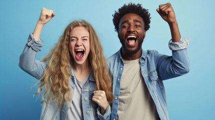 Sticker - man and a woman are both cheering excitedly with their fists raised, wearing denim jackets, against a blue background