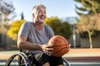 © Made360 - Happy senior man in wheelchair playing basketball on outdoor court