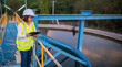 © reewungjunerr - Environmental engineers work at wastewater treatment plants,Water supply engineering working at Water recycling plant for reuse,Check the amount of chlorine in the water to be within the criteria.