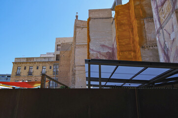 Wall Mural - Romantic backstreet, side street and alleys in historic old town of Cartagena, Spain with historic Spanish style architecture facades, a landmark sightseeing tourist spot in downtown