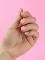 Step-by-step instructions for nail extension on gel tips. Manicure, hands in the foreground. Pink background. Copy space