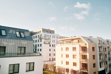 Wall Mural - EU Modern European complex of apartment buildings and outdoor facilities. Condo exterior. White facade of a house.