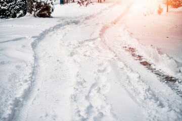 Canvas Print - A snow-covered road that has been plowed. Snow removal after blizzard.