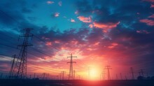 A Depiction Of High-voltage Poles That Transmit Electricity, With A Red Sky And Sunset In The Background