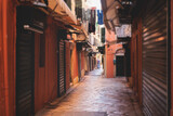 Fototapeta Uliczki - Corfu street view, Kerkyra old town beautiful cityscape, Ionian sea Islands, Greece, a summer sunny day, pedestrian streets with shops and cafes, architecture of historic center, travel to Greece