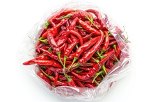Isolated Spicy Red Chili Peppers On A White Plate