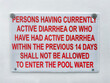 Diarrhea warning sign on a pool side