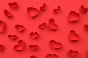 Wall Mural - Abstract pattern of red paper hearts on color background